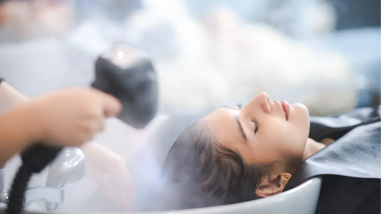 Wedding Hair Styles for a Glamorous Look 1 a serene, elegantly styled salon interior showcasing a luxurious japanese head spa treatment in progress, emphasizing the transformative beauty regimen ahead of a wedding day.